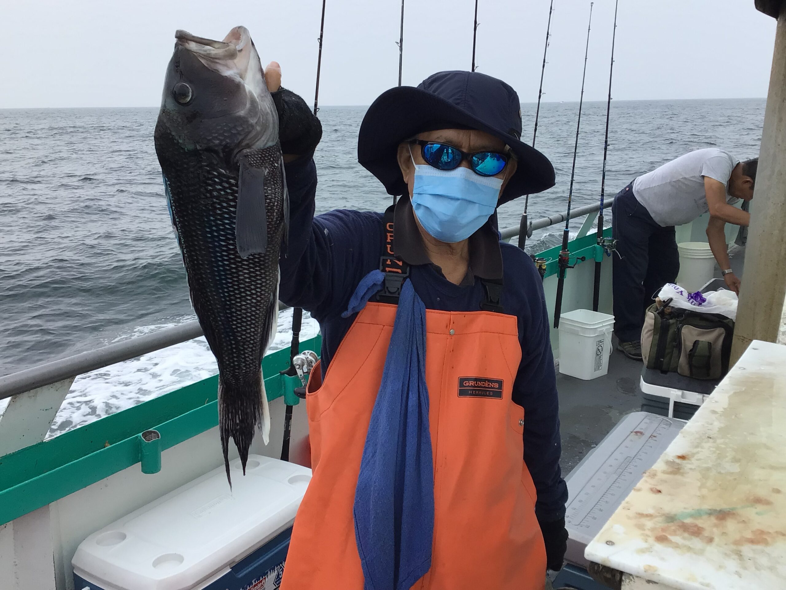 a person holding a fish in the water