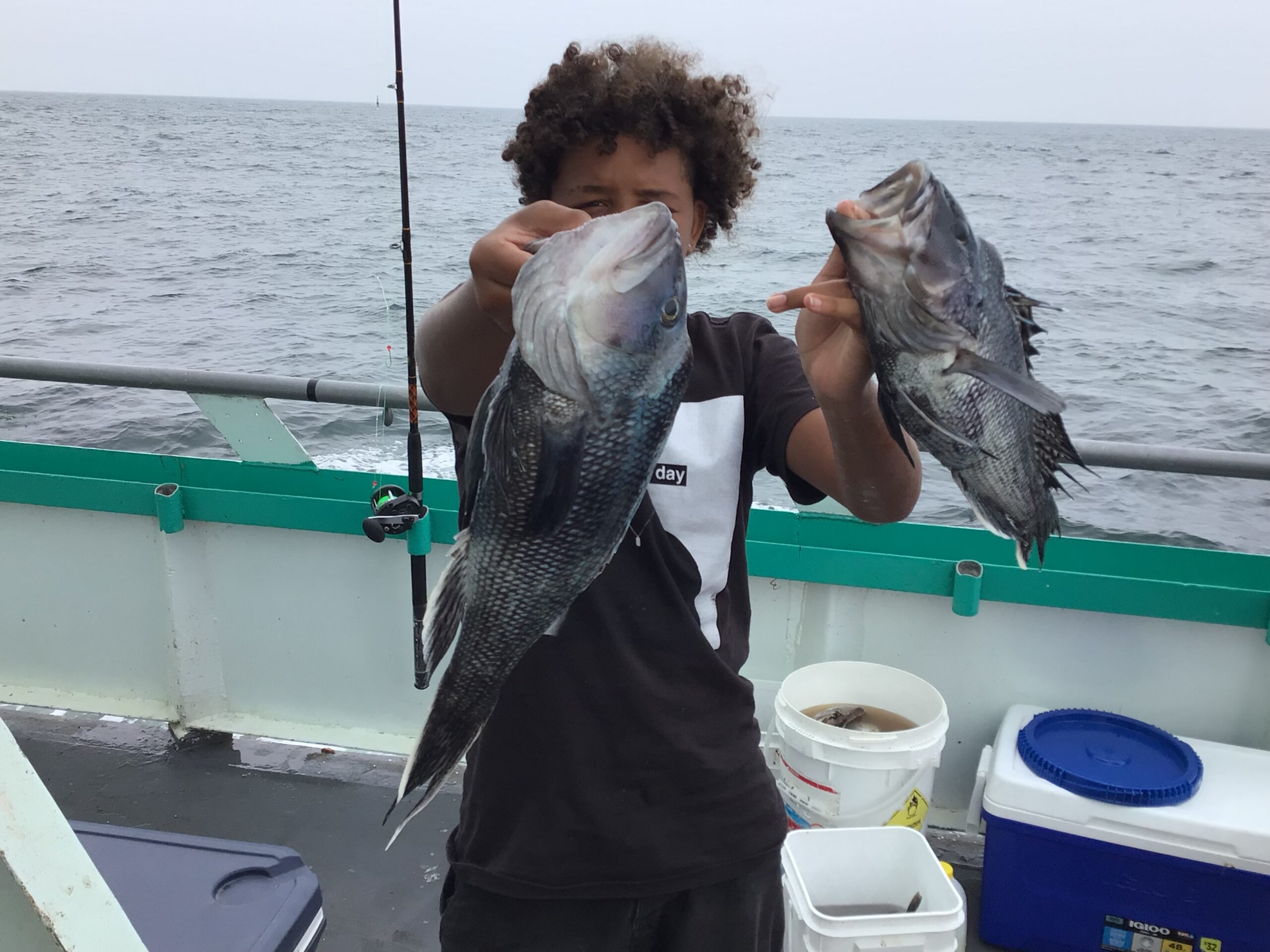 a person holding a fish in the water