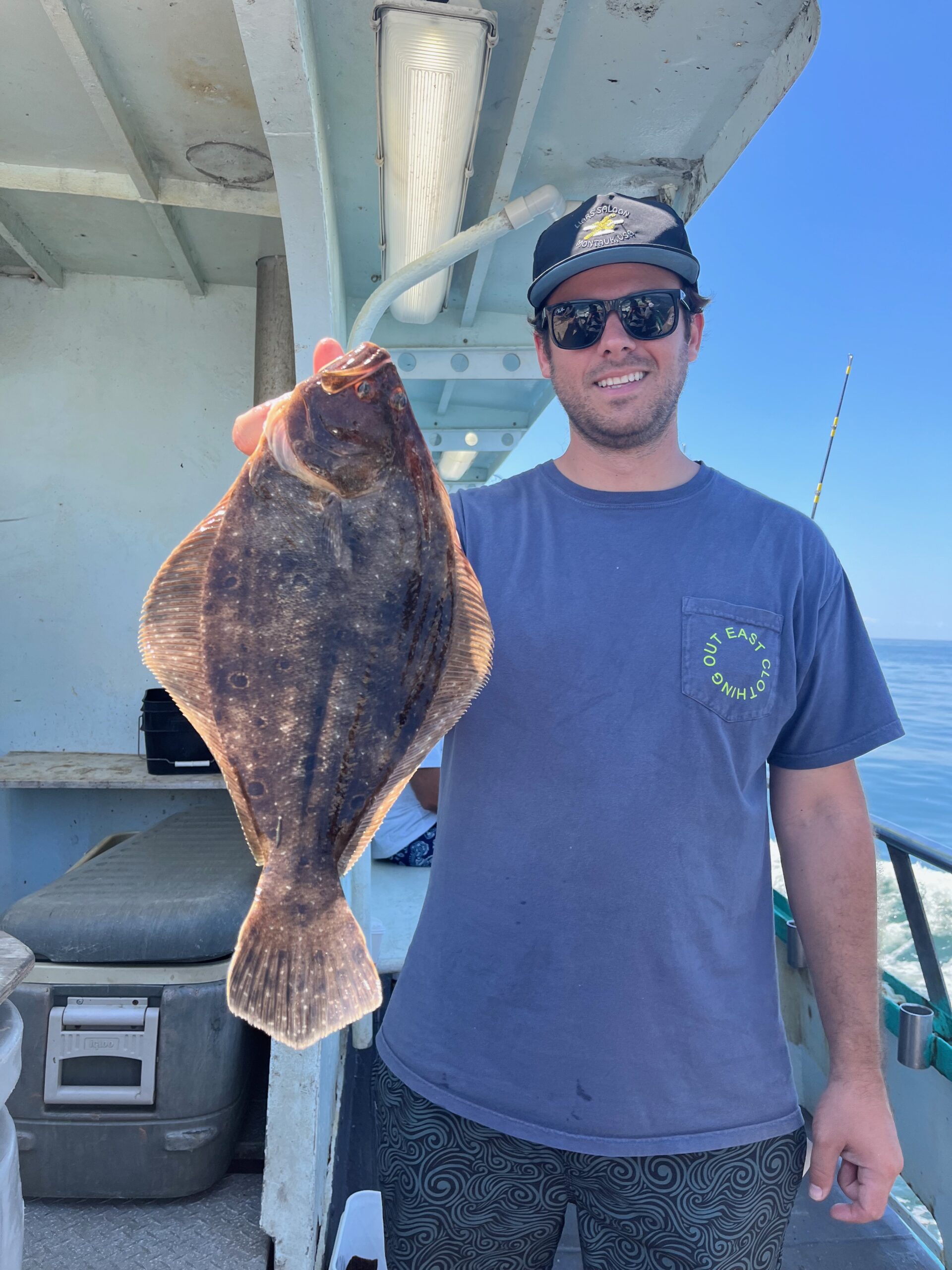 a man holding a fish