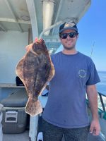 a man holding a fish