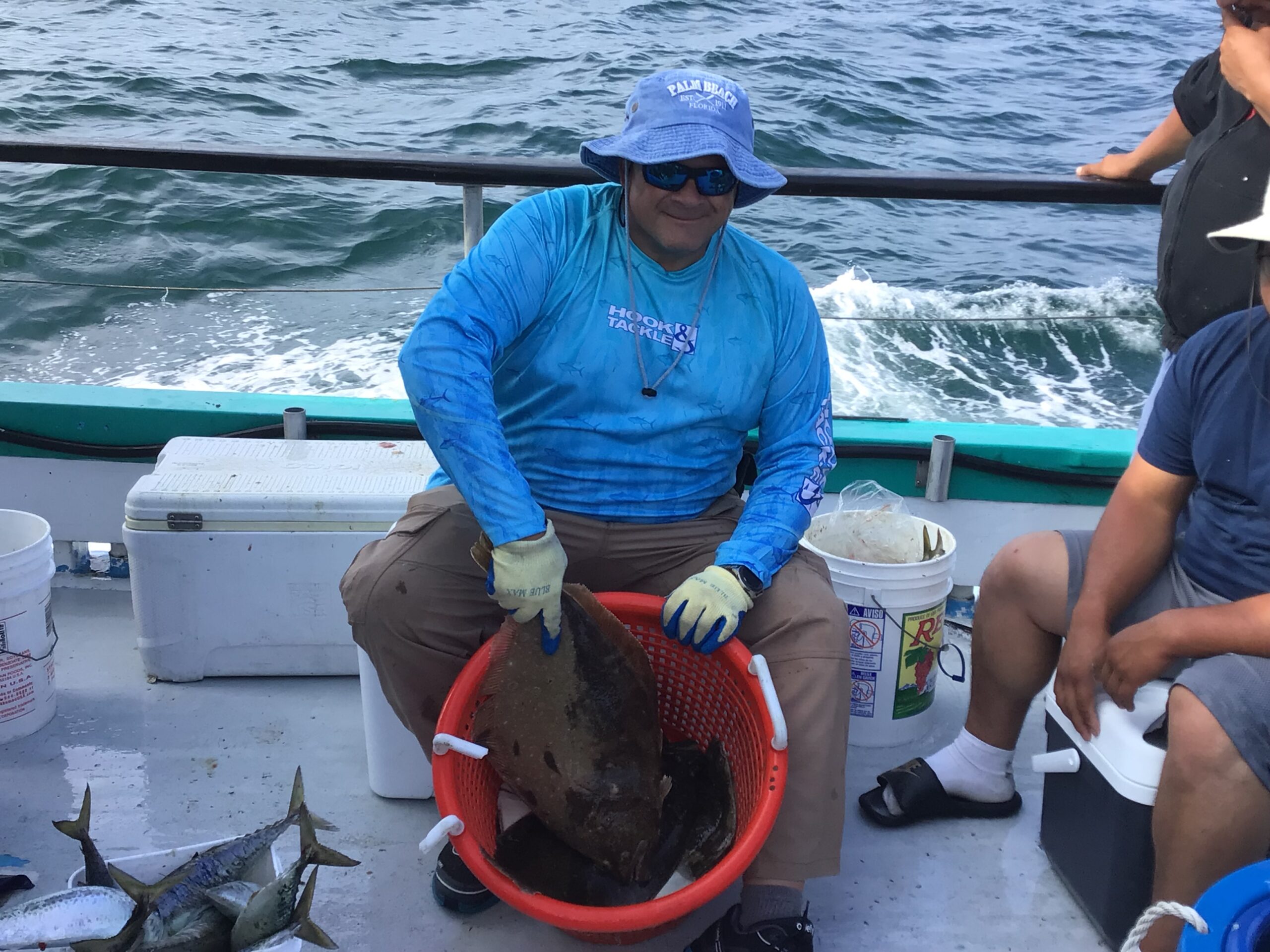 a man and a woman sitting on a boat in the water