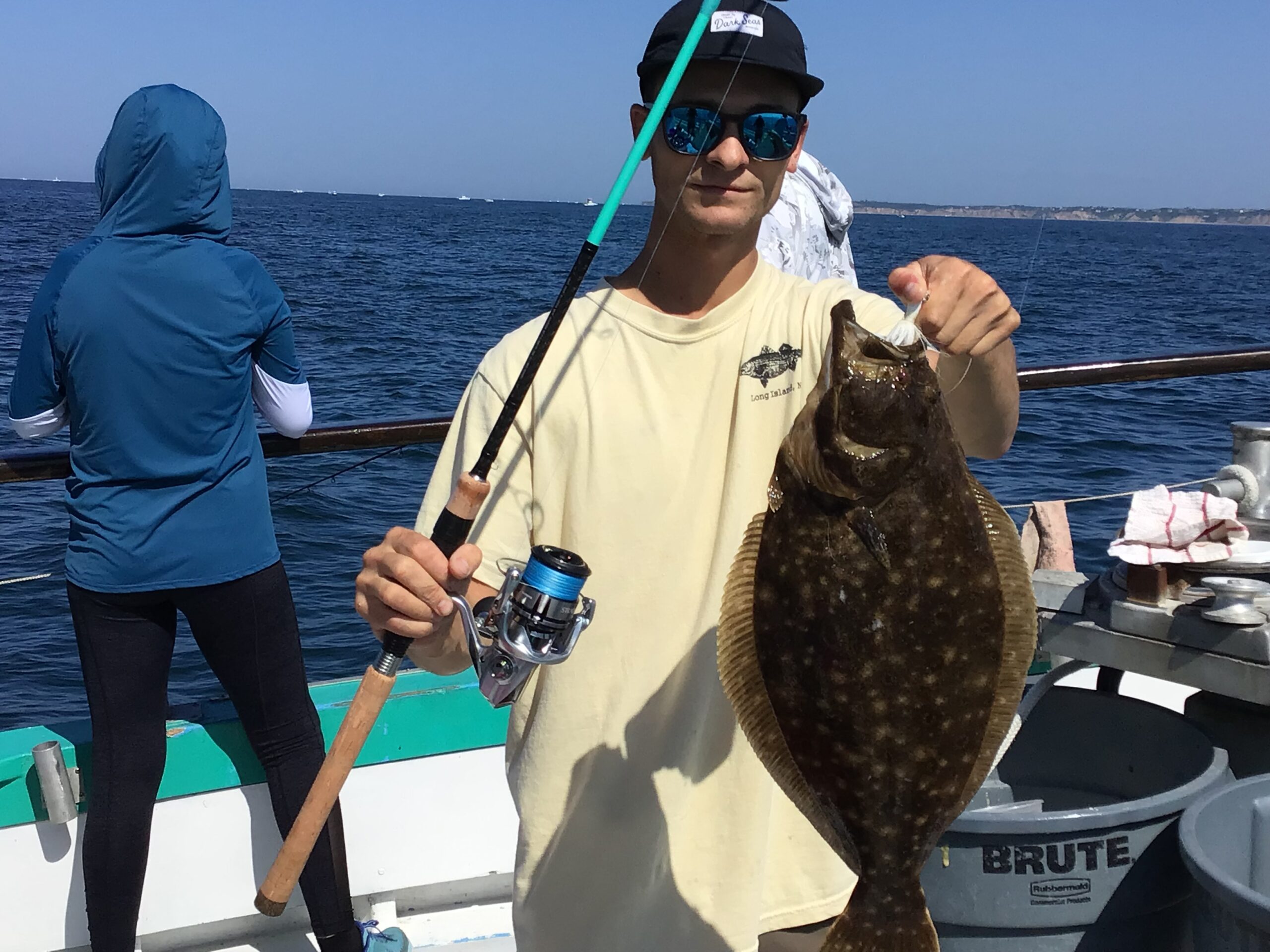 a person holding a fish in the water