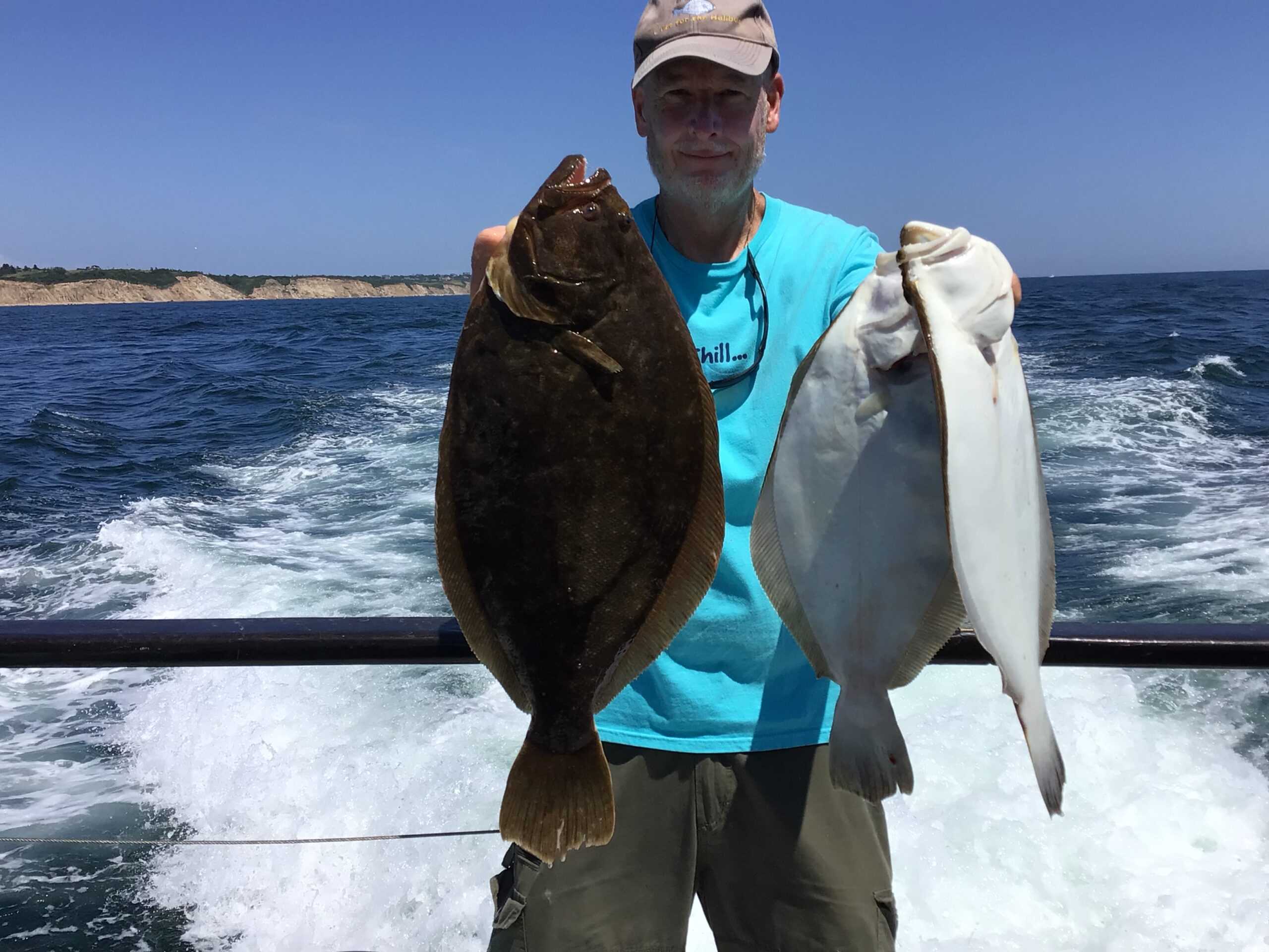 a person holding a fish in the water