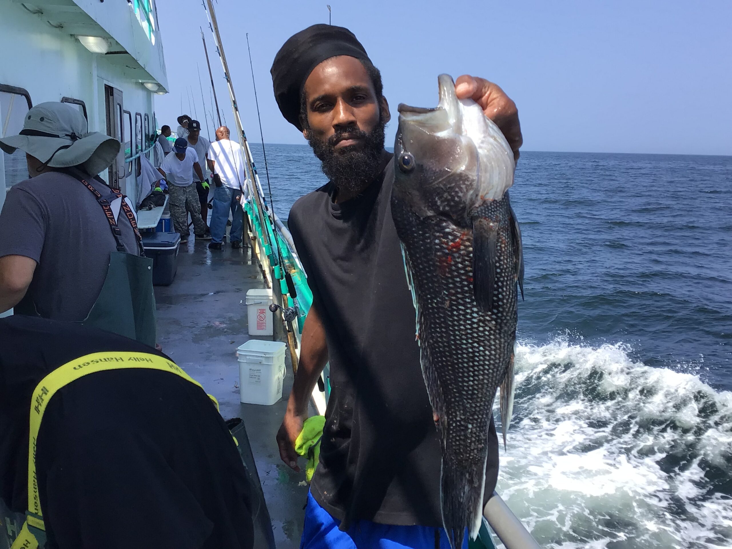 a person holding a fish in the water