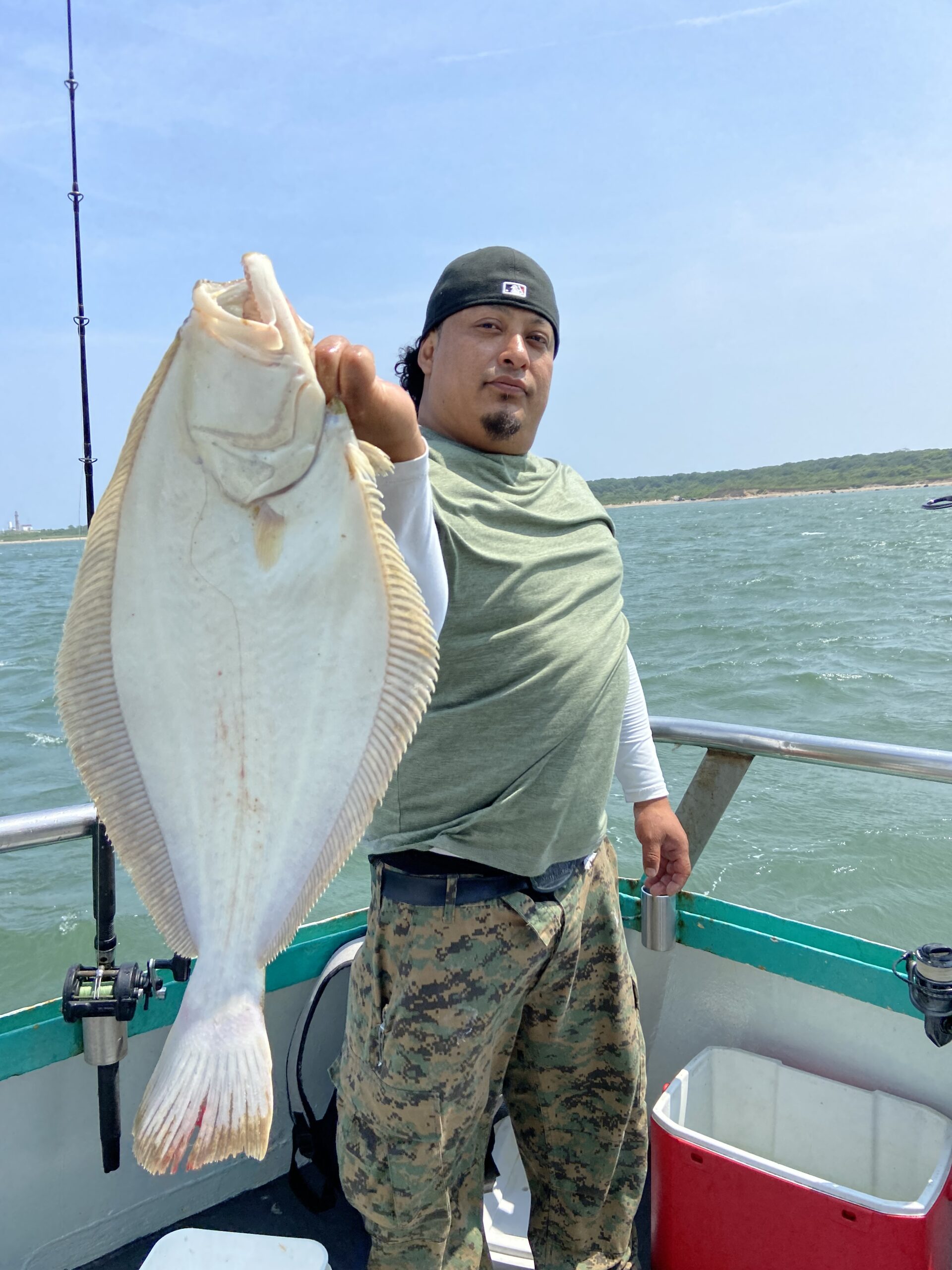 a person holding a fish in the water