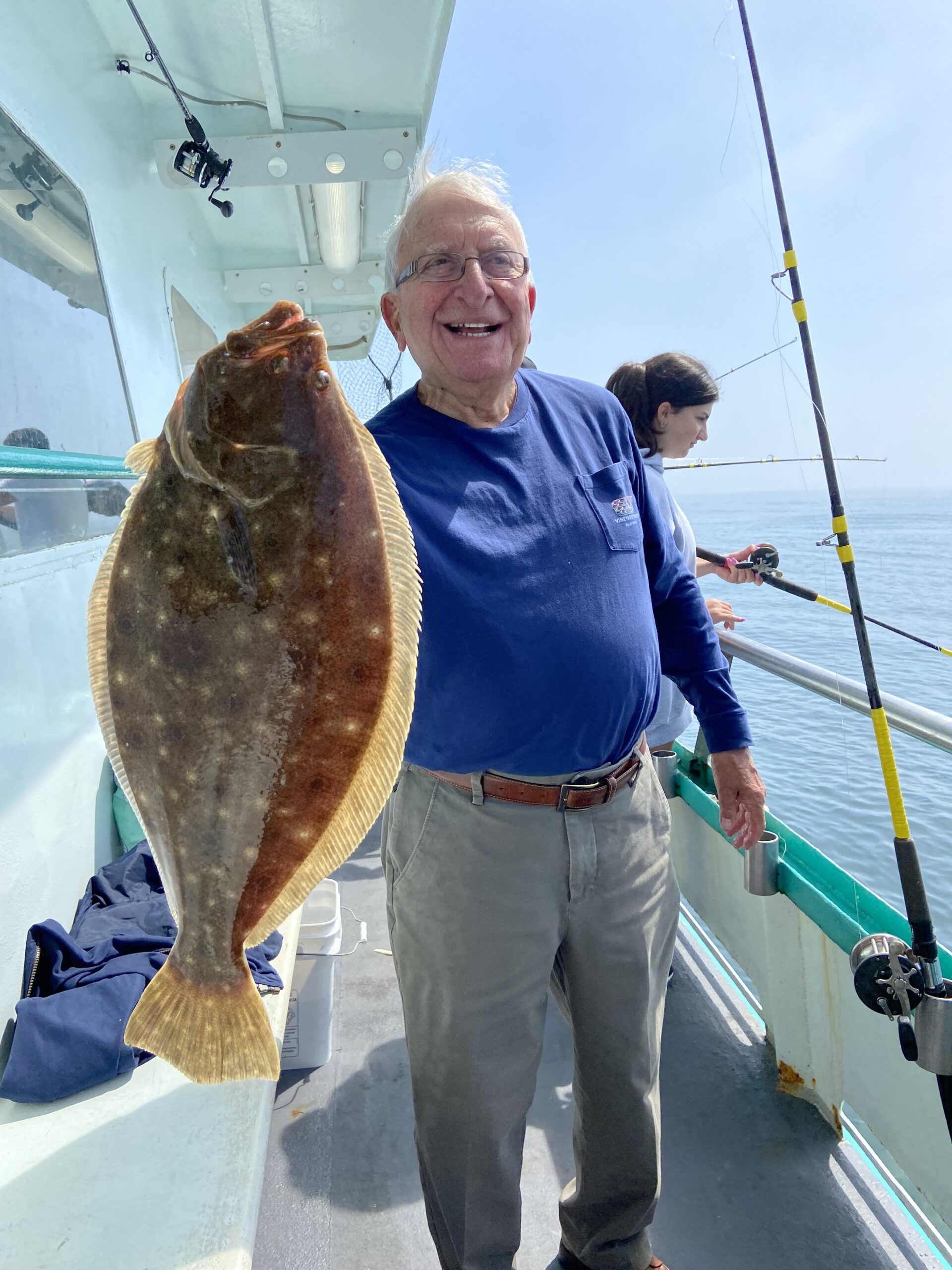 a man holding a fish