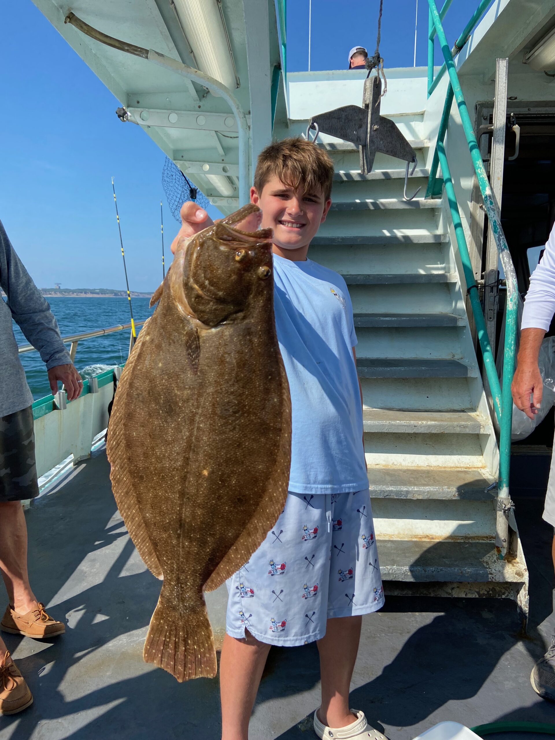 a man holding a fish