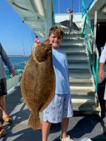 a man holding a fish
