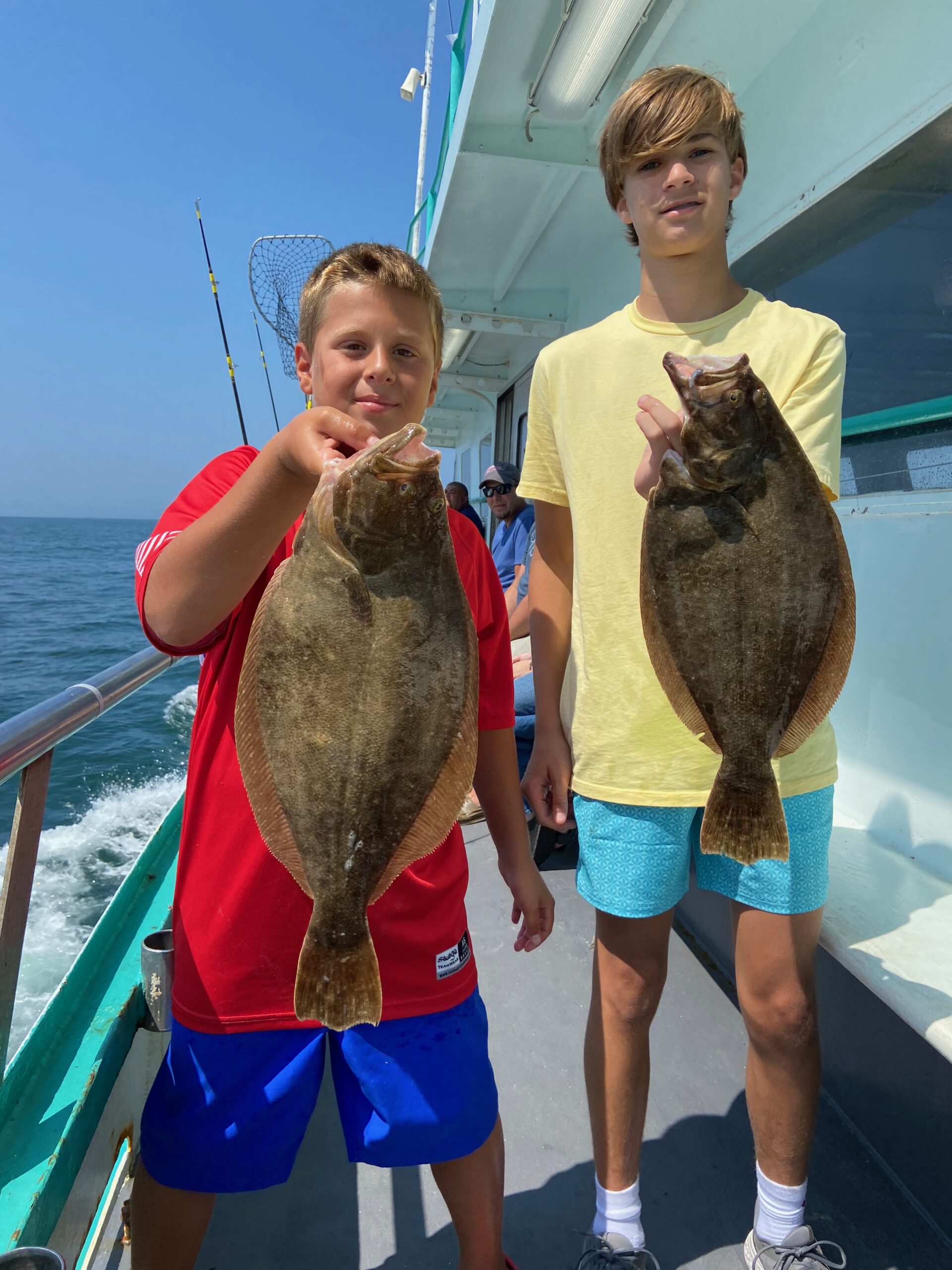 a person holding a fish in the water