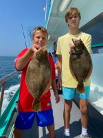 a person holding a fish in the water
