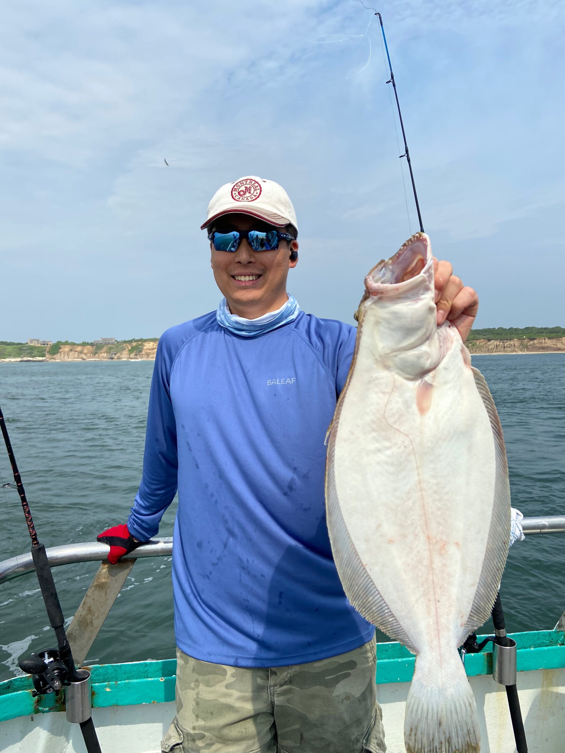 a man holding a fish in the water