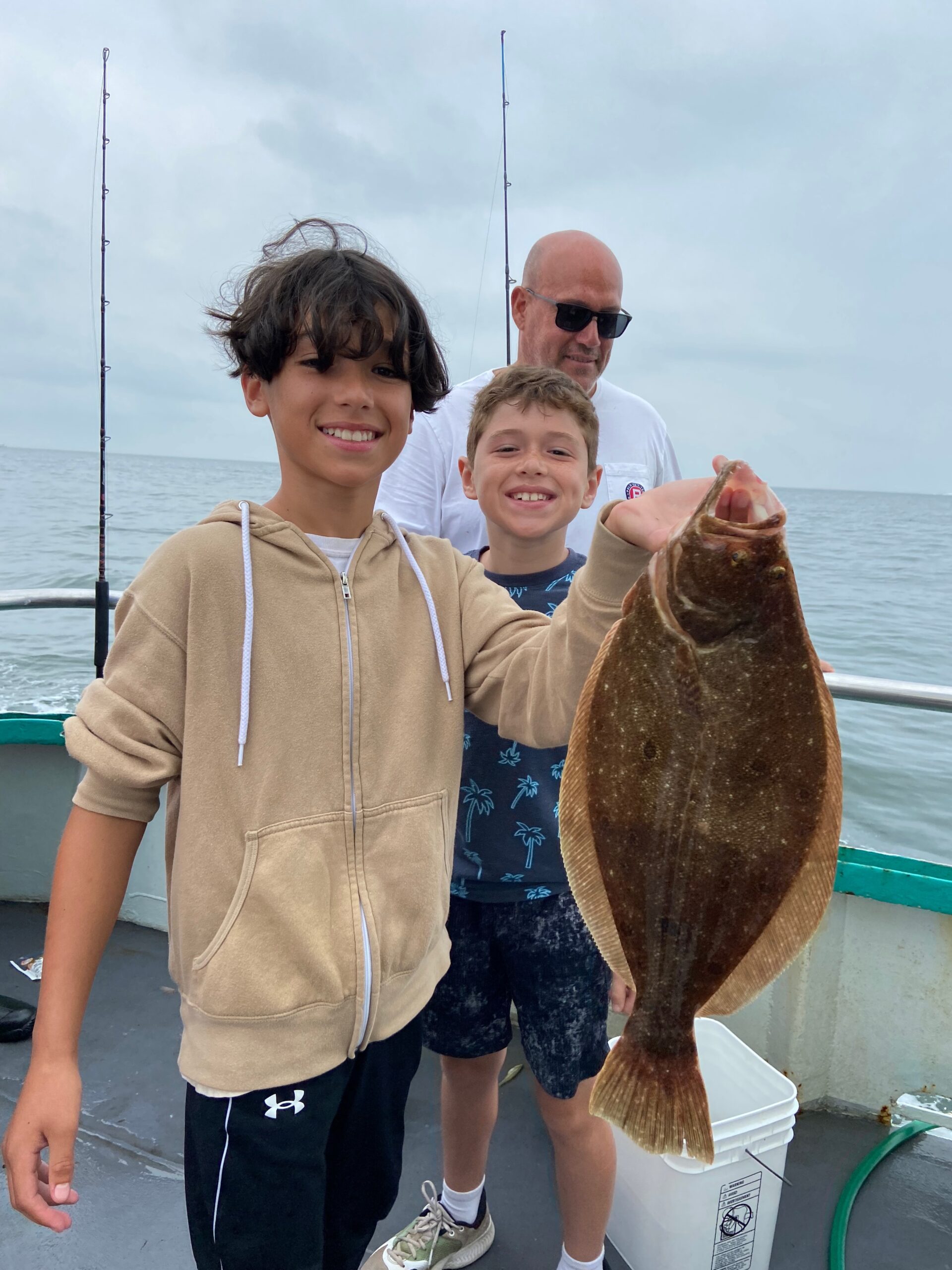 a person holding a fish in the water