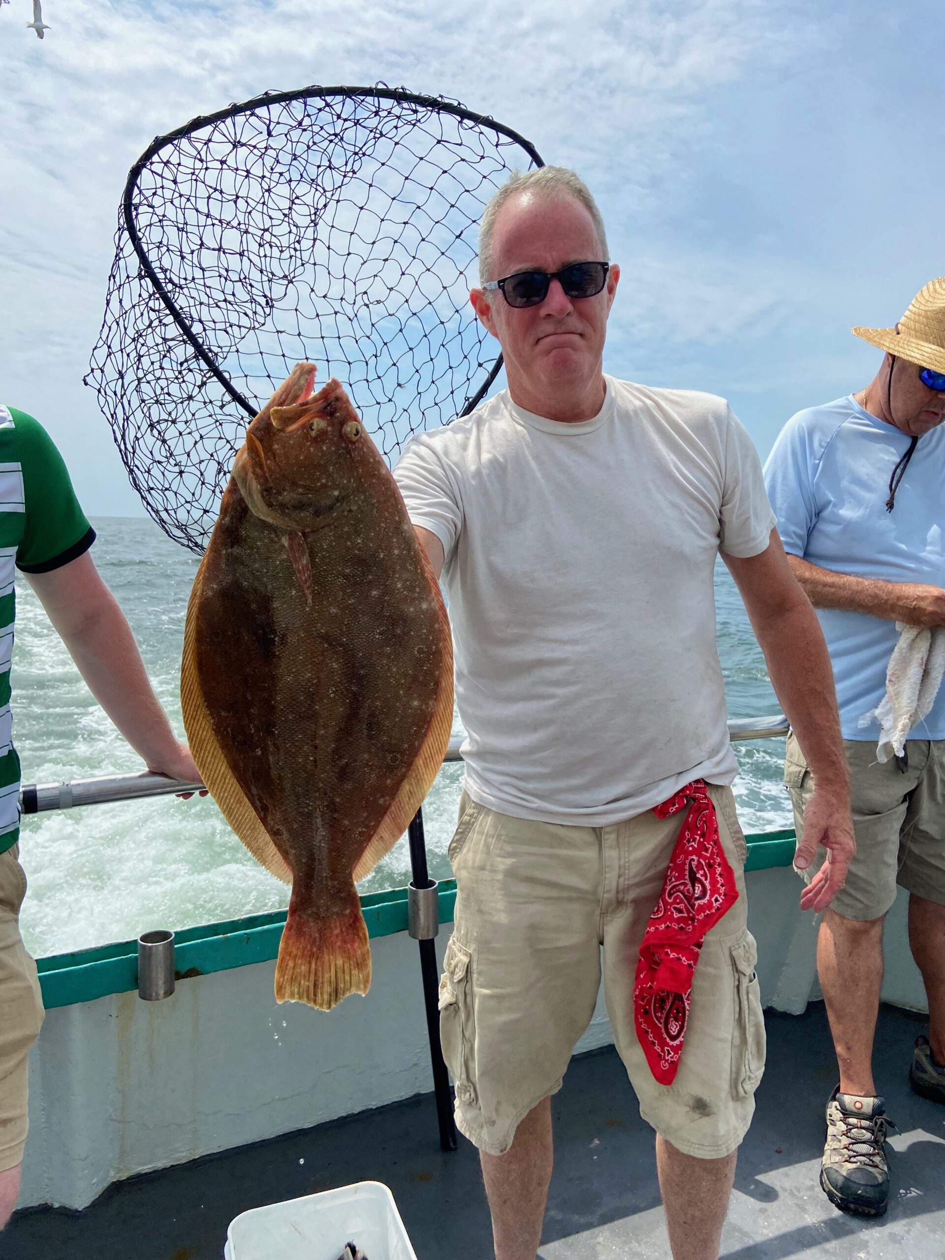 a man holding a fish