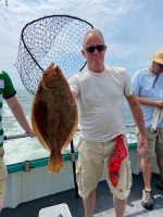 a man holding a fish