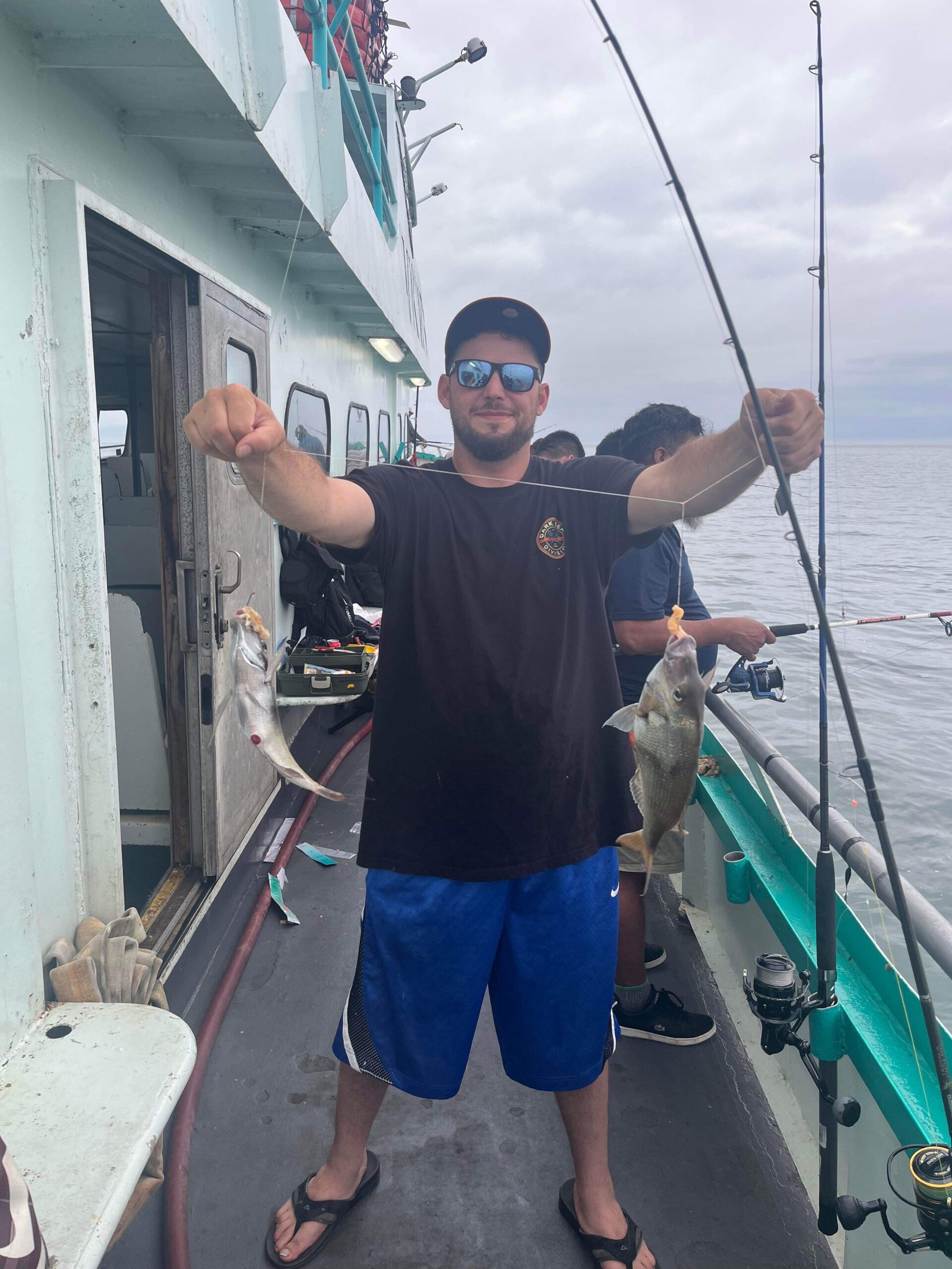 a man holding a fish