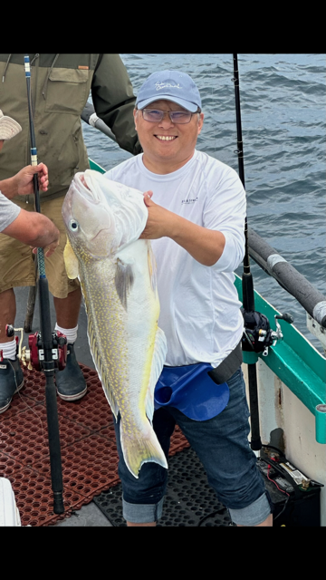 a person holding a fish