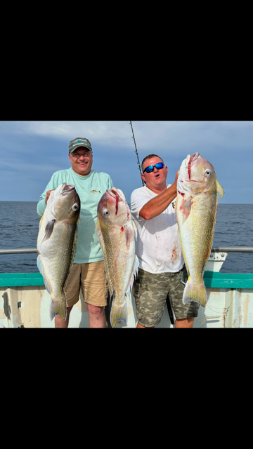 a man holding a fish