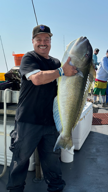 a person holding a fish