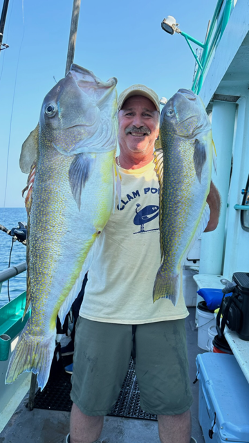 a person holding a fish