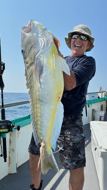 a man holding a fish
