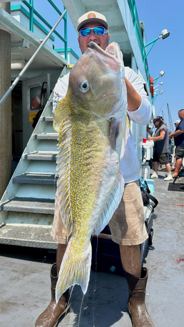 a person holding a fish