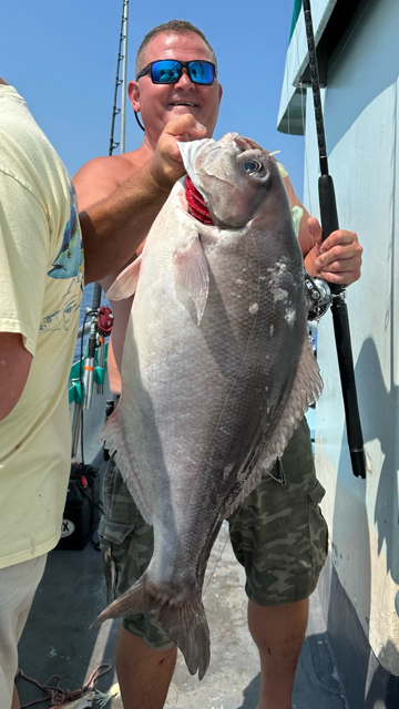 a person holding a fish