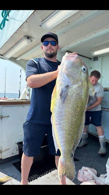 a man holding a fish