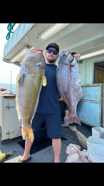 a person holding a fish