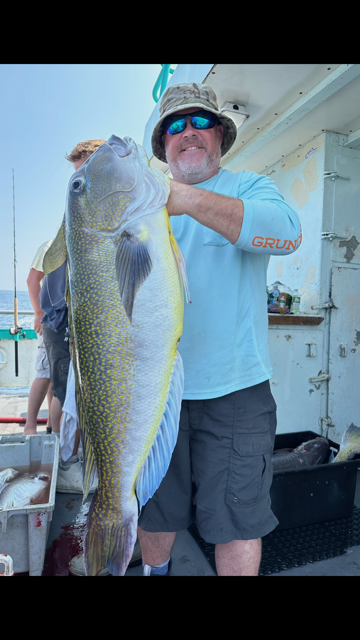 a person holding a fish