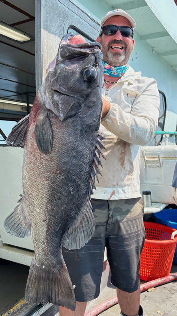 a man holding a fish