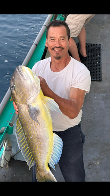 a man holding a fish