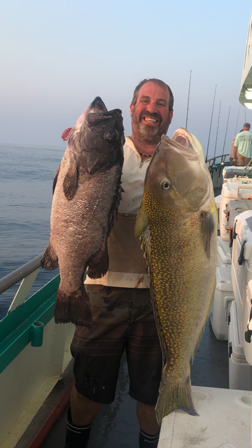 a man holding a fish