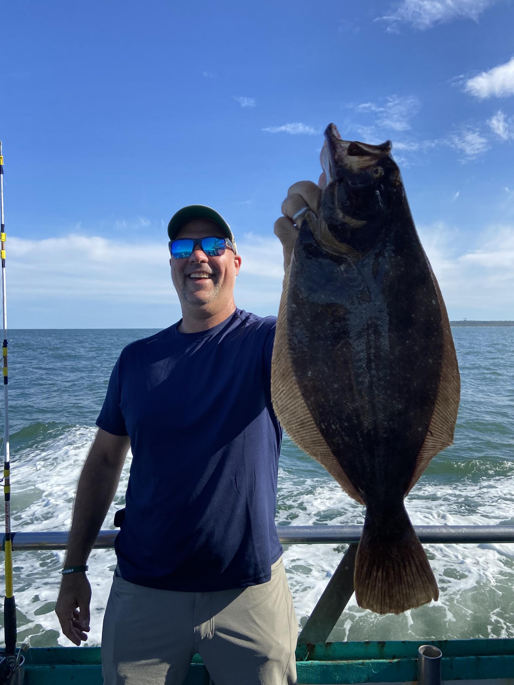 a person holding a fish in the water