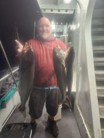 a person holding a fish