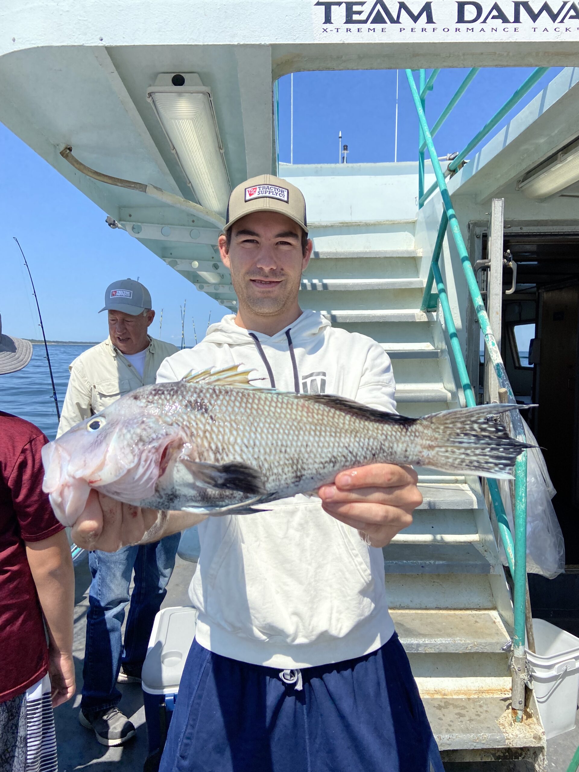 a person holding a fish