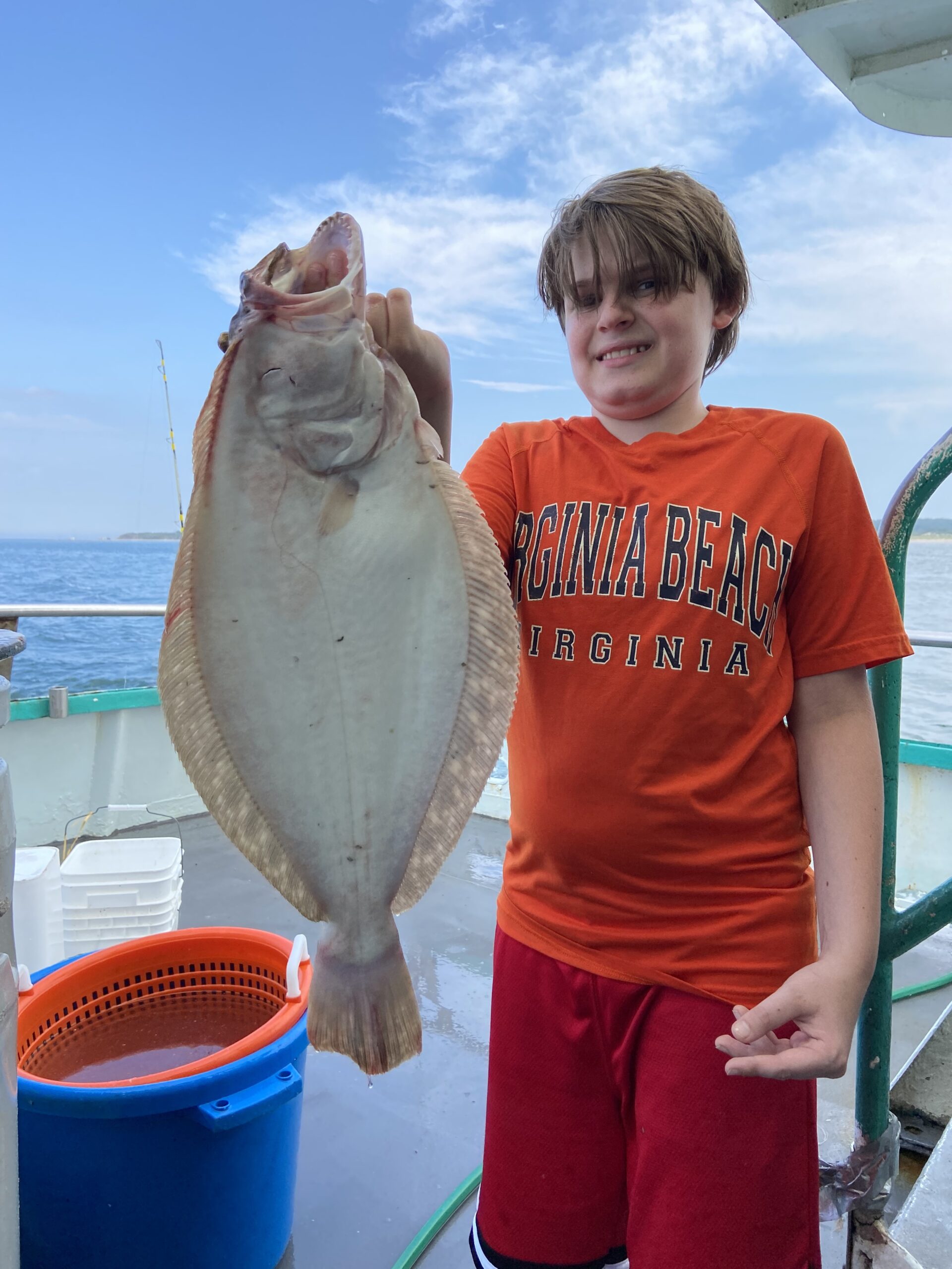 a man holding a fish