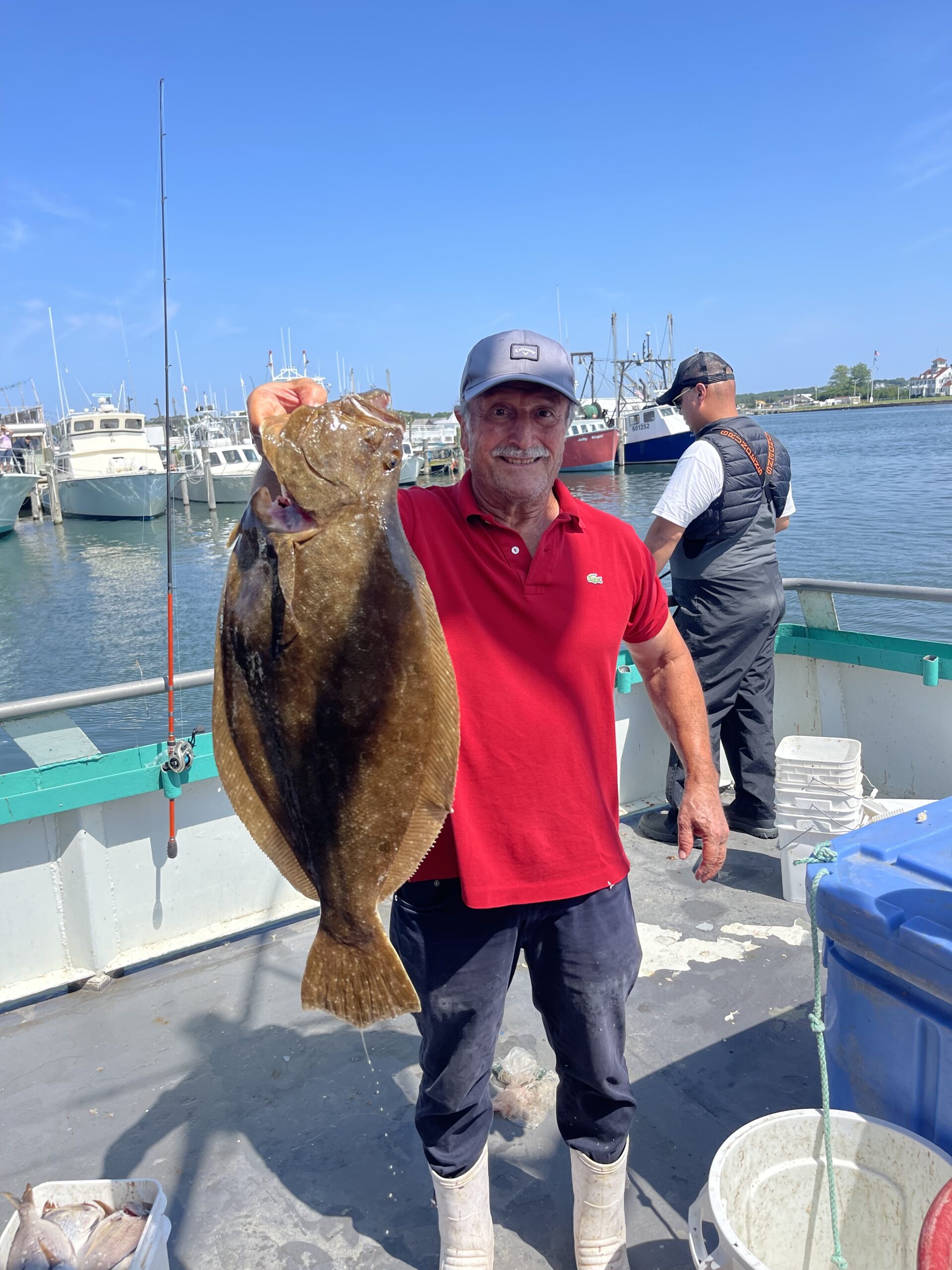 a person holding a fish in the water