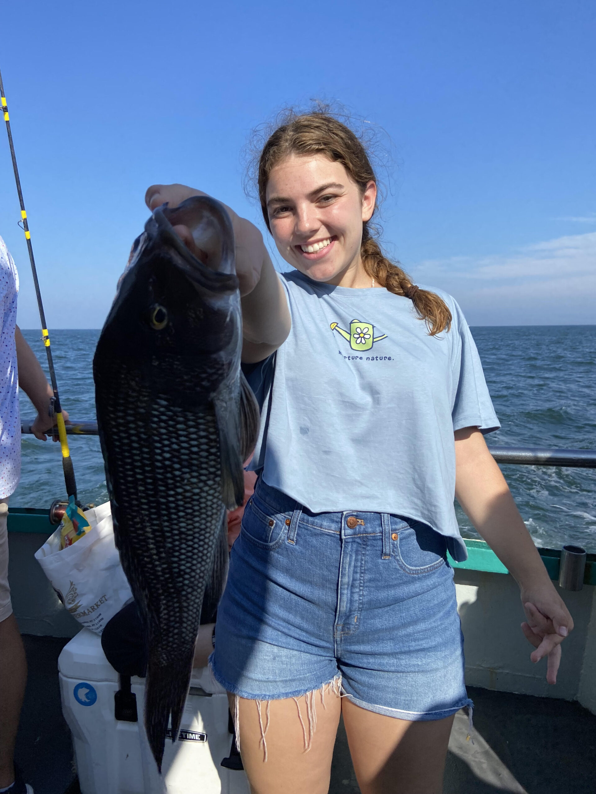 a person holding a fish