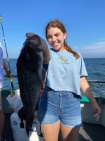 a person holding a fish