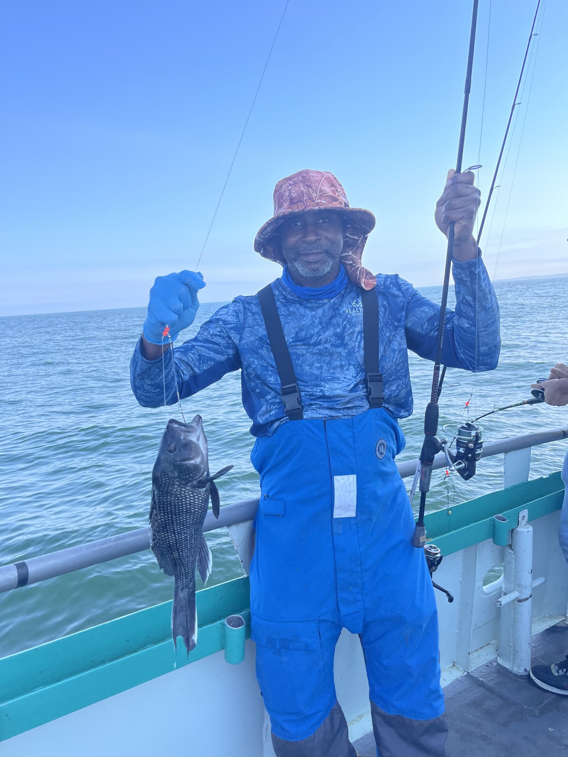a man standing on a boat in the water