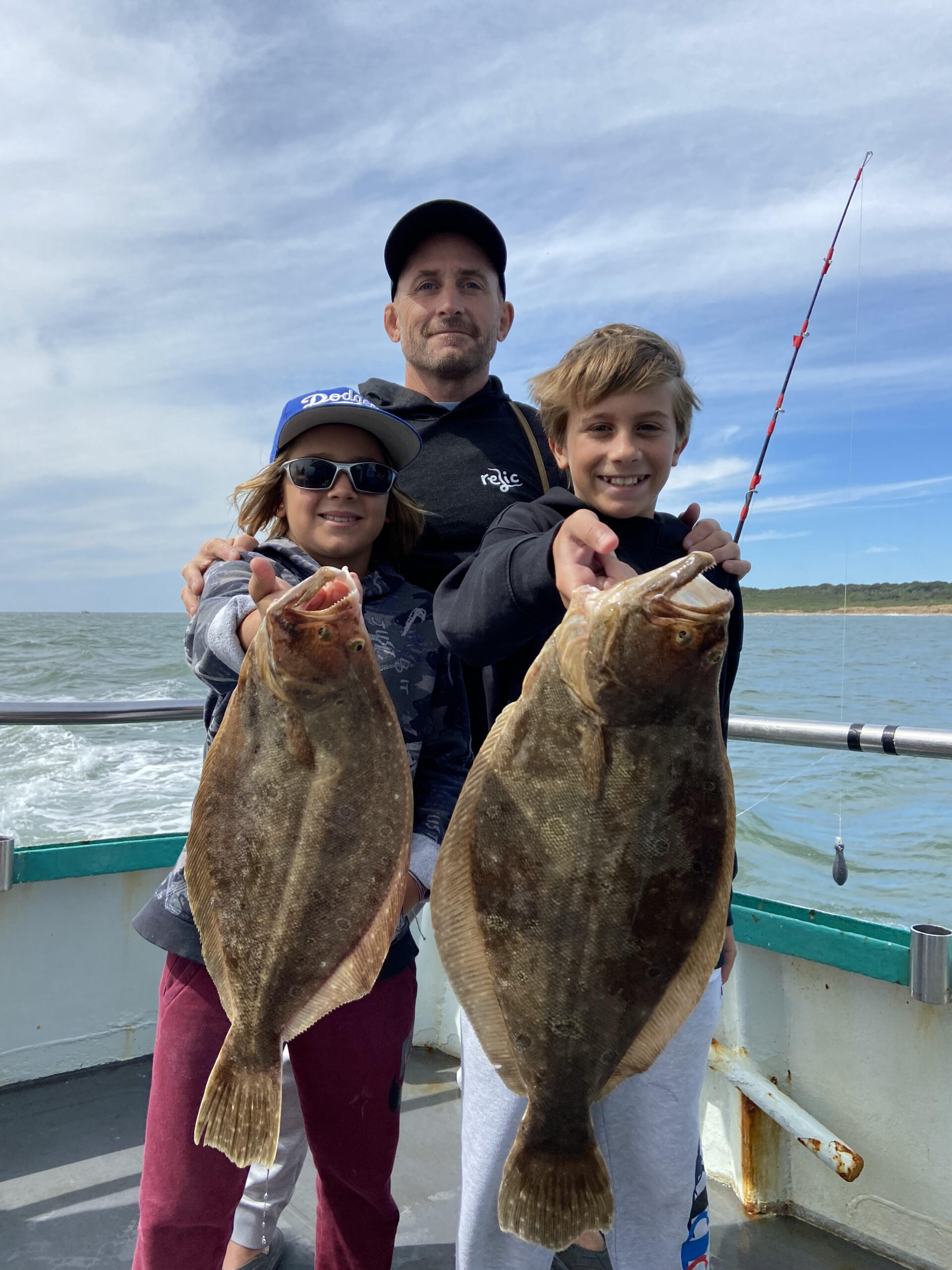 a man holding a fish in the water