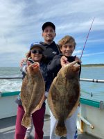 a man holding a fish in the water