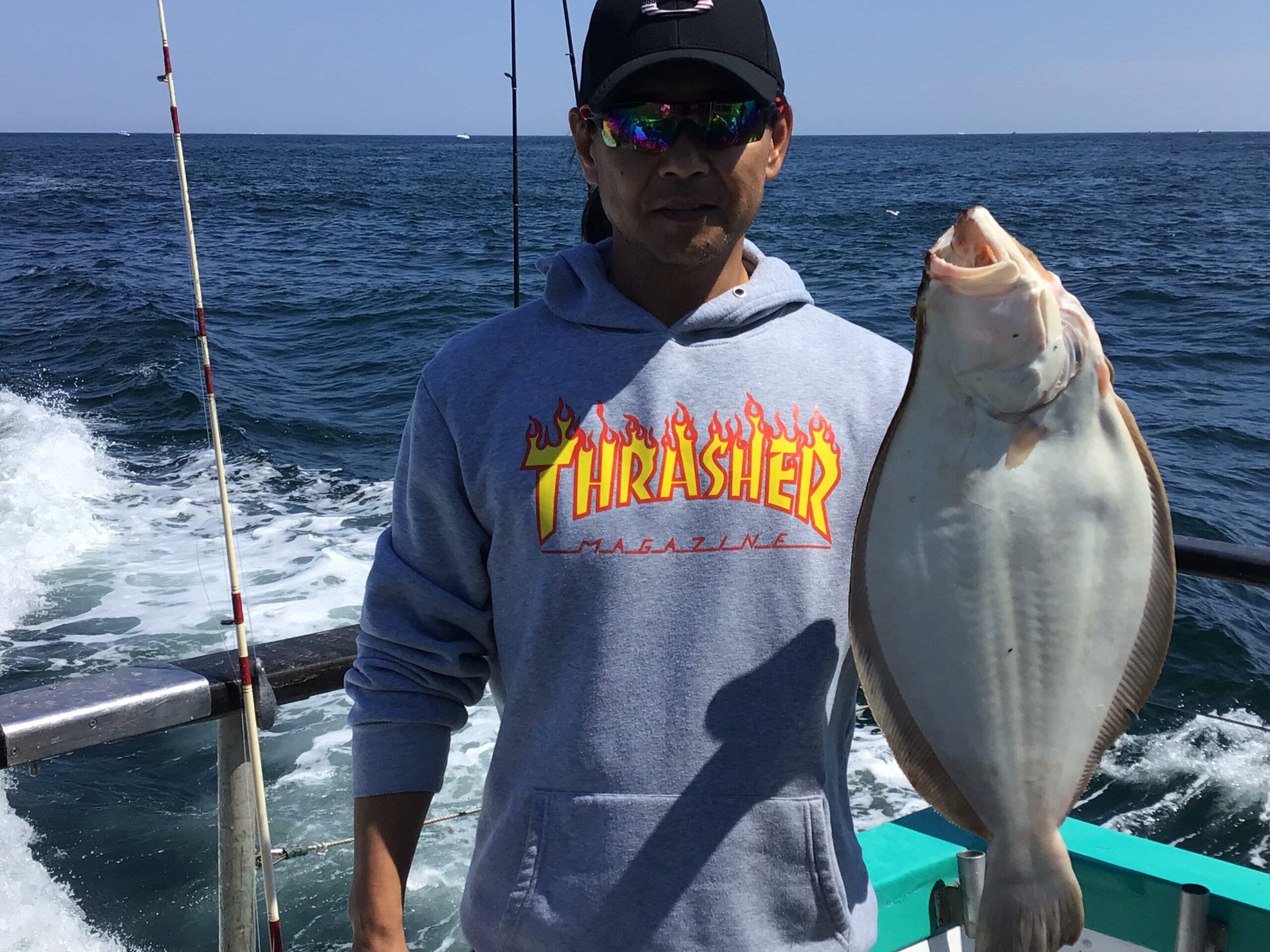 a man holding a fish in the water