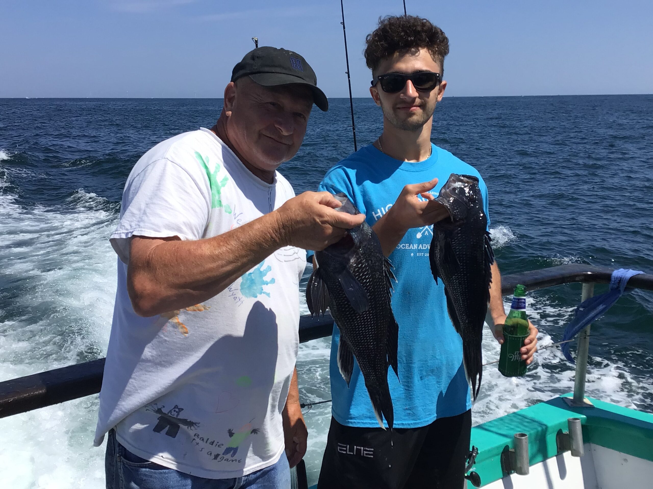 a man standing next to a body of water