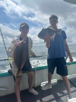 a group of people standing in the water