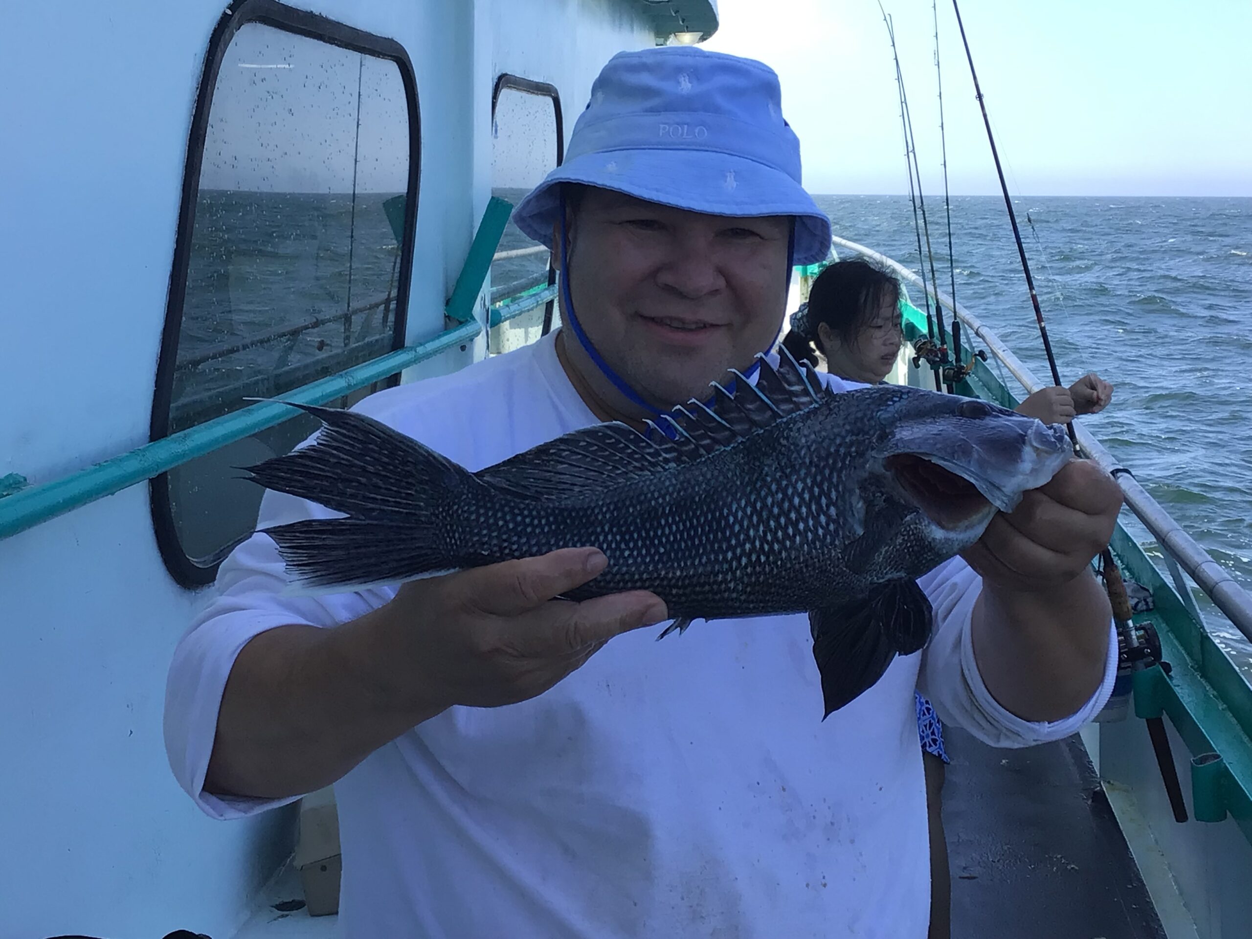 a person holding a fish in the water