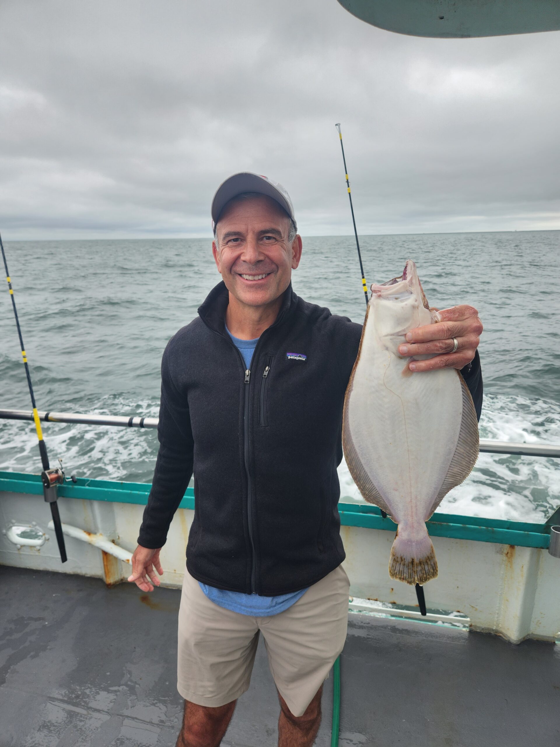 a person holding a fish in the water