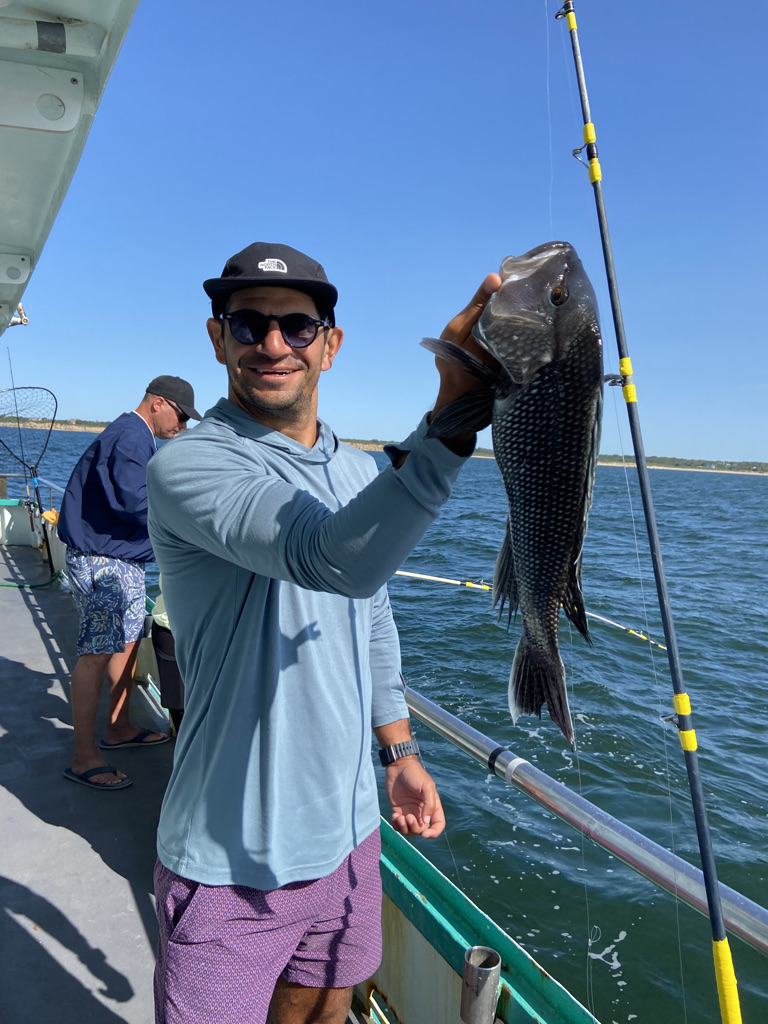 a person standing on a boat in the water