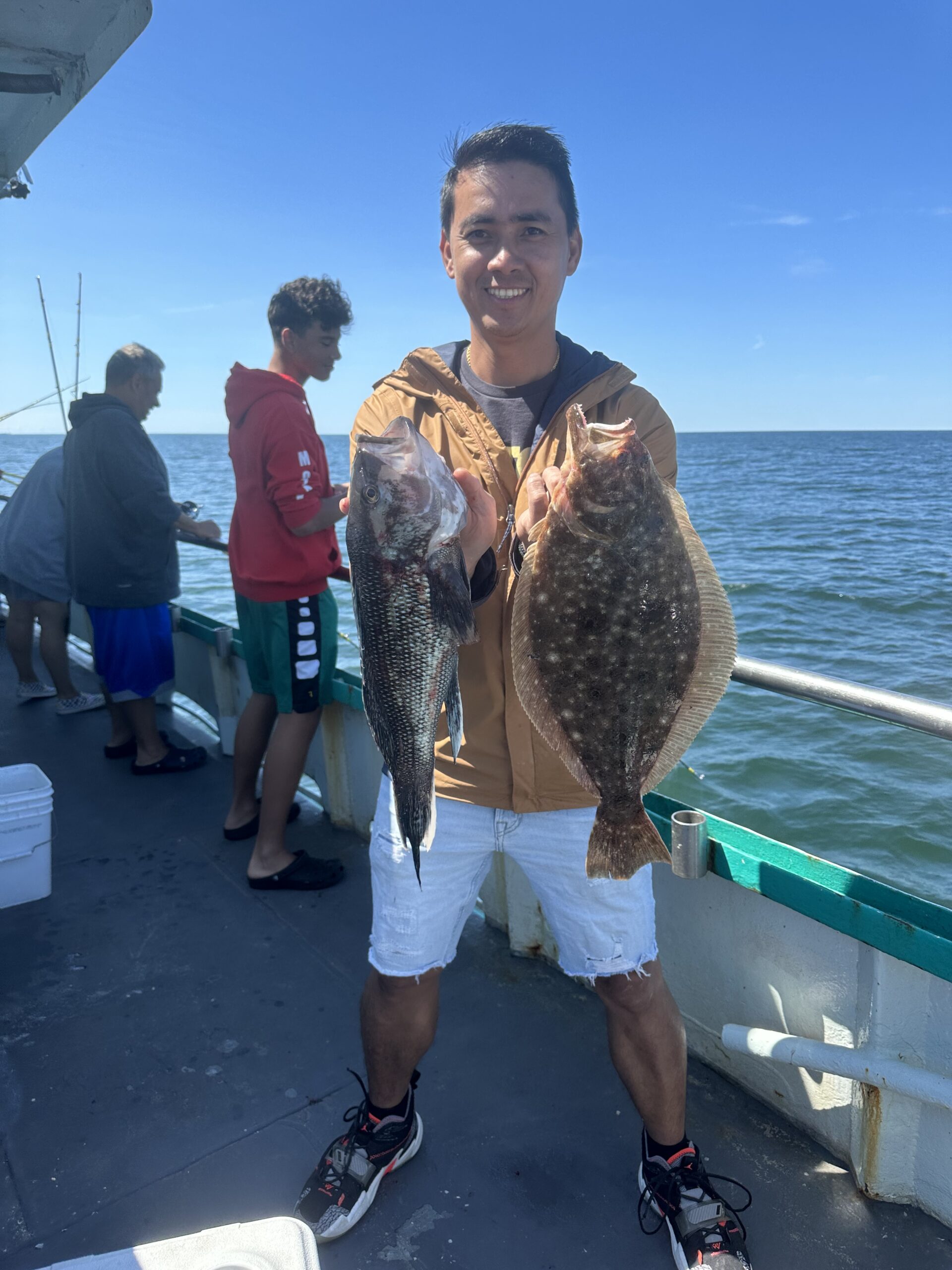 a man holding a fish in the water