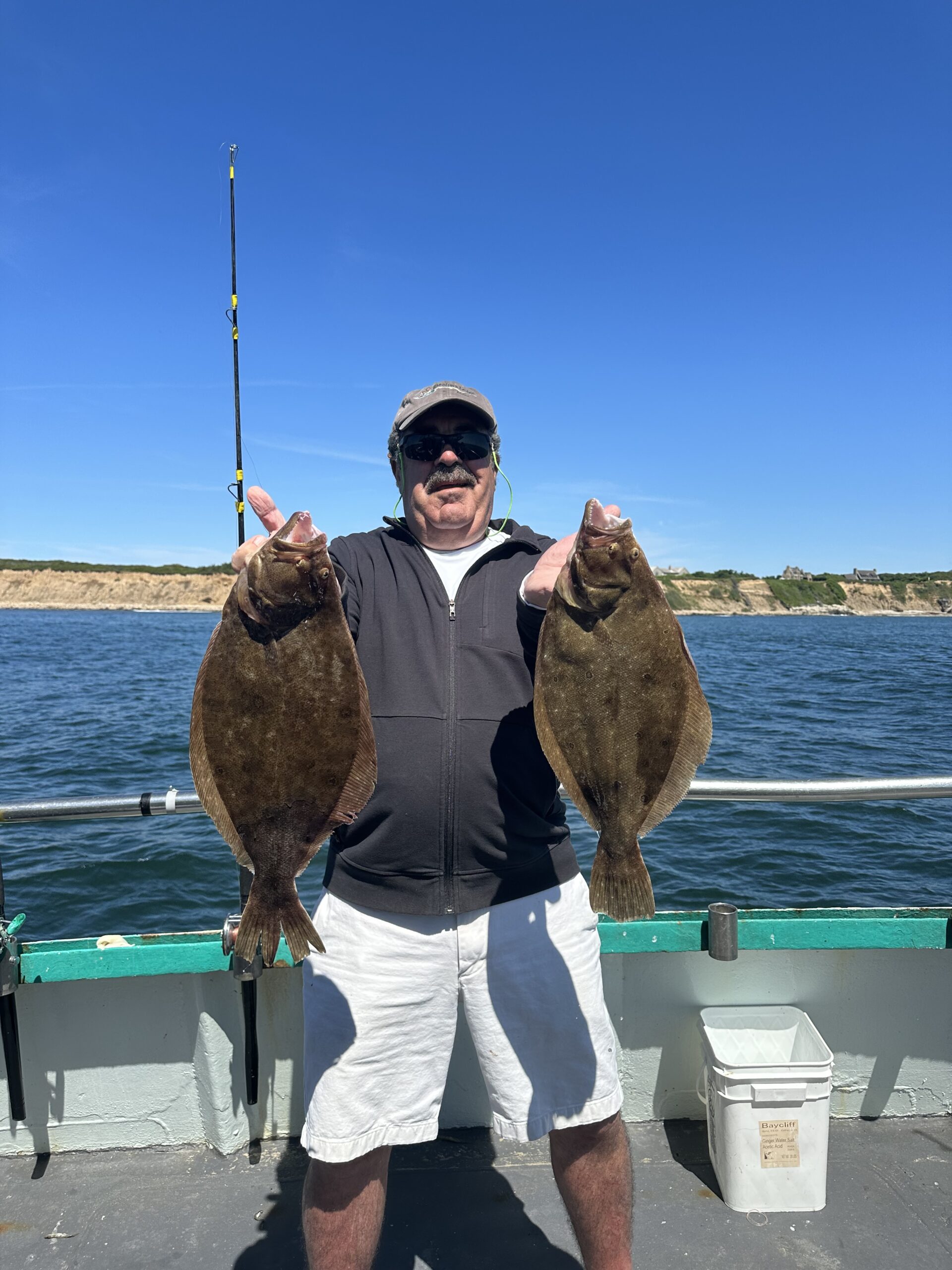 a person holding a fish in the water